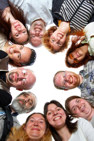 Social Media for Small Business Brings New Faces Group of happy faces looking down at the camera